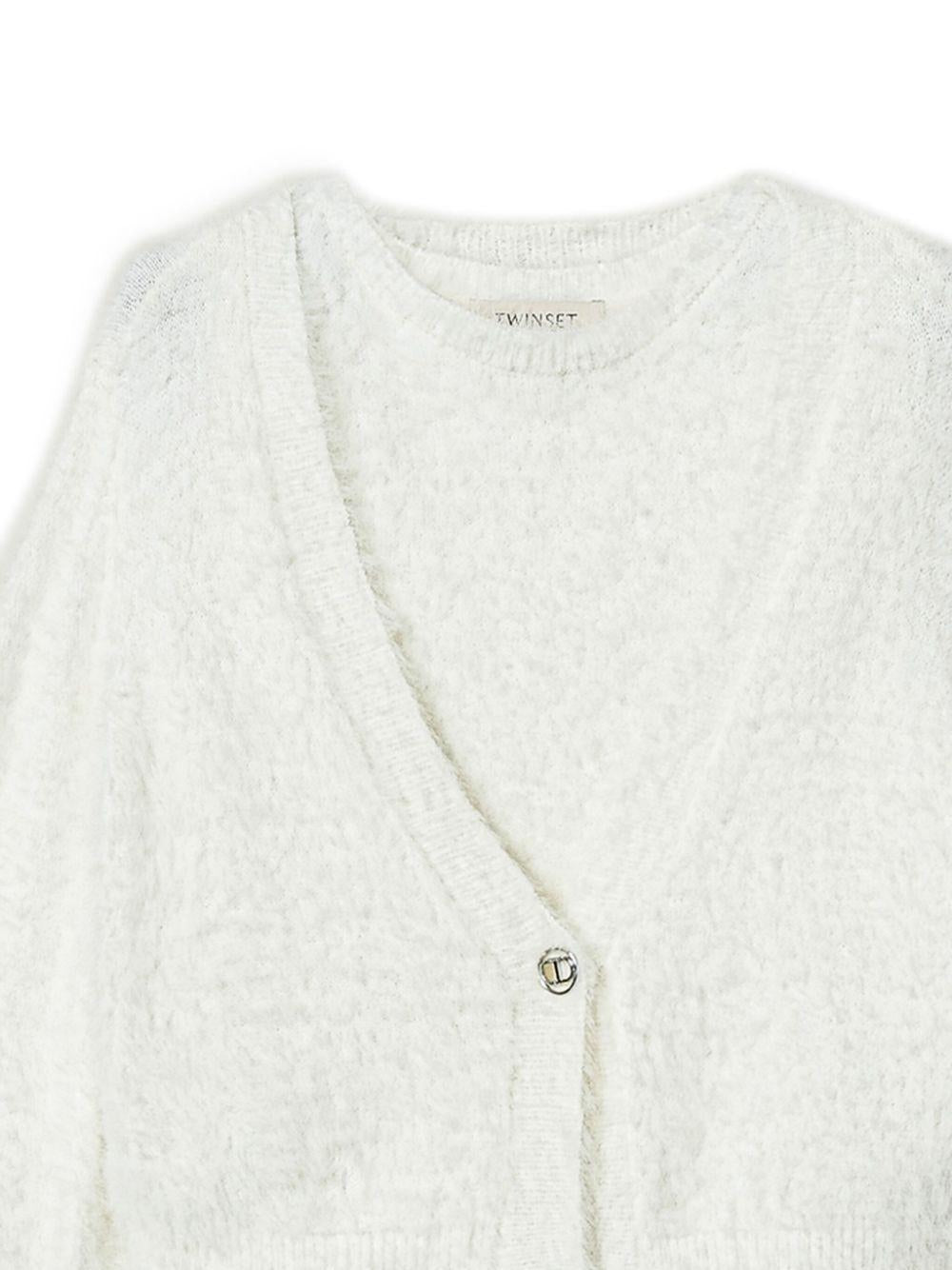 Maglia e cardigan con bottone Oval T